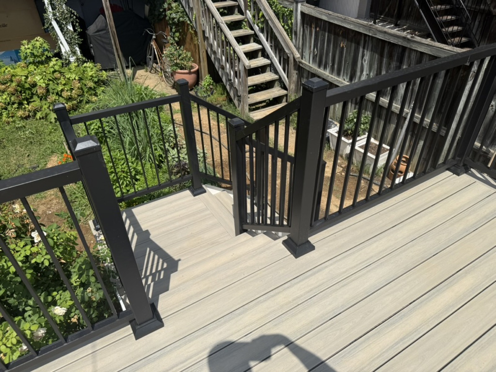 Cream composite deck black aluminum rail