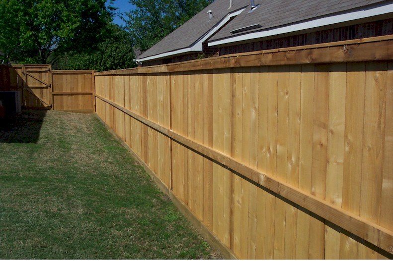 Custom wood privacy fence with cap board