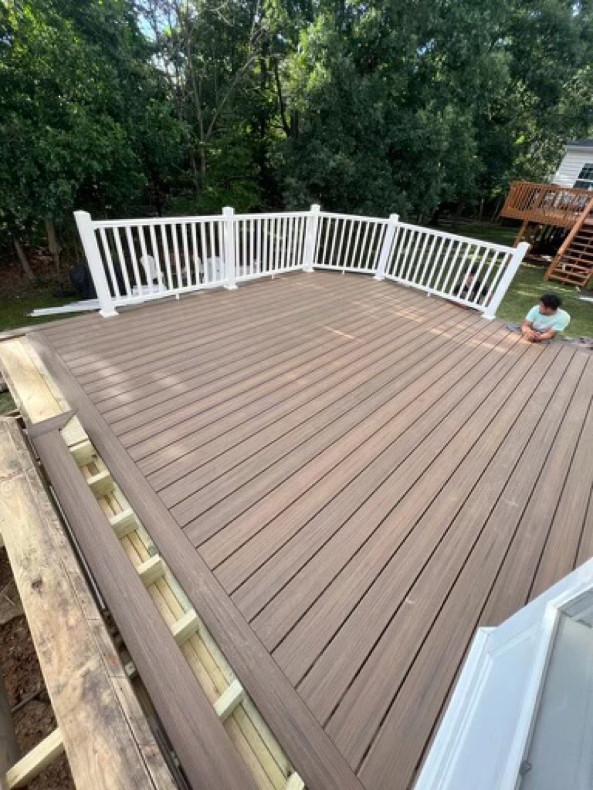 Gray refinished deck white railing