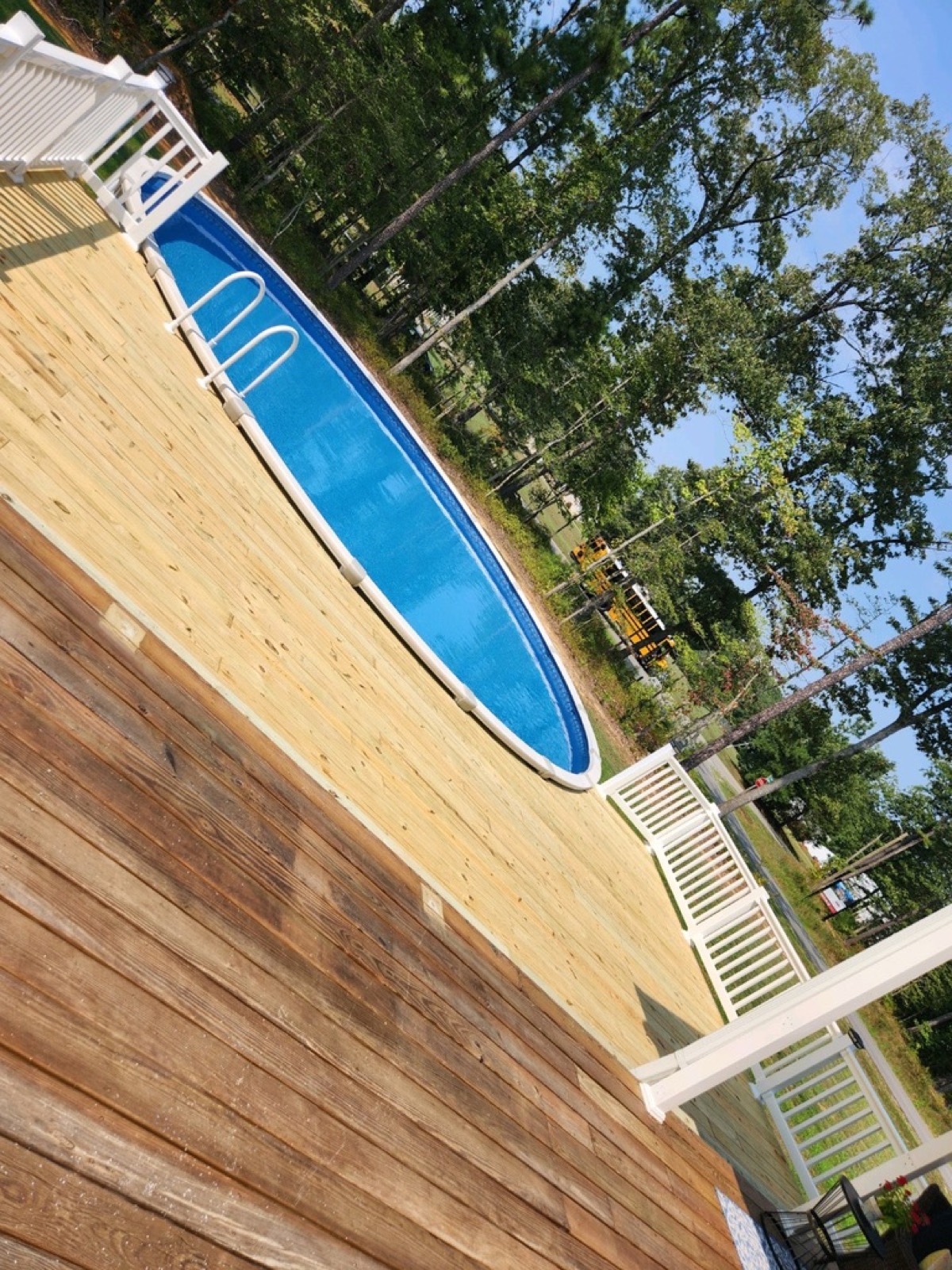 Pool deck white railing pressure-treated wood