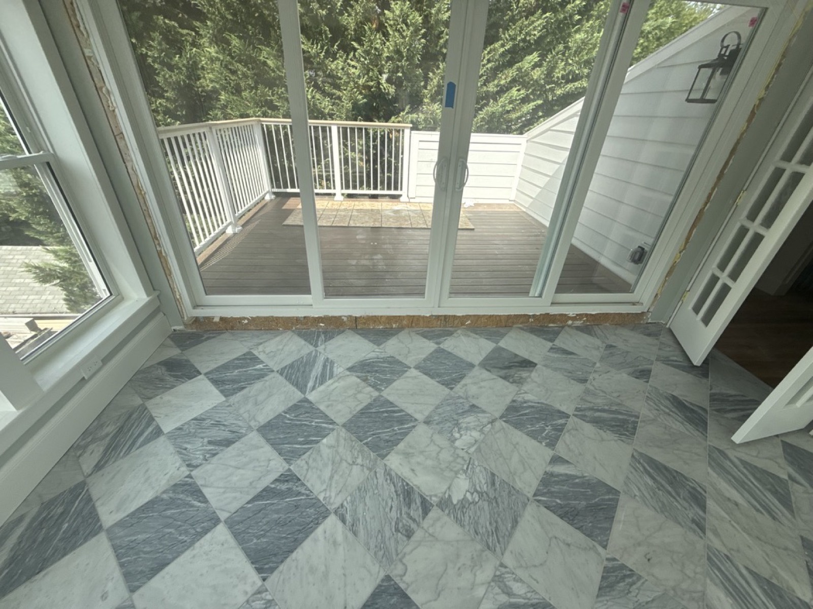Sunroom marble floor deck beyond