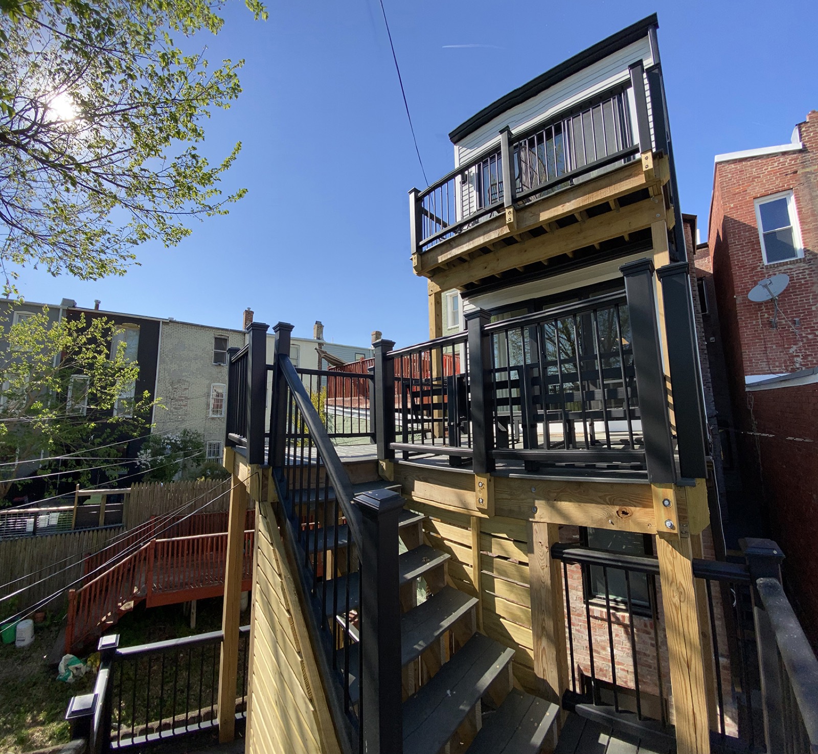 Two story deck black railing DC rowhouse