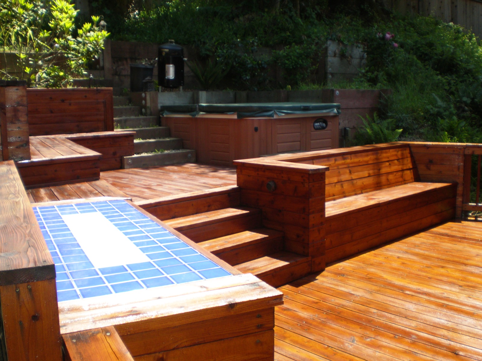 Custom wood deck with built-in bench seating and wide steps
